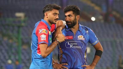 Delhi Capitals captain Axar Patel, left, with Mumbai Indians pace spearhead Jasprit Bumrah. Sportzpics for IPL
