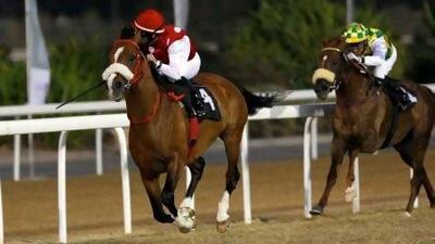 Micro Demuro used a late run aboard Daffagh Al Asayl, left, to defeat the favourite Naseem.
