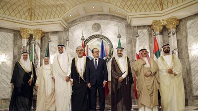 Sheikh Mohammed bin Rashid, Vice President and Ruler of Dubai, with, from left, Abdullatif Al Zayani, secretary general of the GCC; Kuwaiti emir Sheikh Sabah Al Ahmed Al Sabah; Qatari emir Sheikh Tamim bin Hamad Al Thani; Sayyid bin Tariq Al Said, representing Sultan Qaboos of Oman; French president Francois Hollande; King Salman of Saudi Arabia; and Bahrain’s King Hamad. Christophe Ena / AP Photo