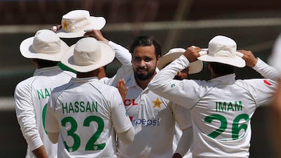 Pakistan bowler Faheem Ashraf celebrates with teammates after taking the wicket of Australia's Nathan Lyon. AP