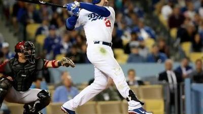 Adrian Gonzalez, right, came to LA via Boston last year and has led Dodgers into first place. Stephen Dunn / AFP
