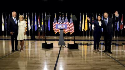 Democratic presidential candidate and former Vice President Joe Biden, his wife Jill Biden, vice presidential candidate Senator Kamala Harris and her husband Douglas Emhoff pose keeping social distance after a campaign event, their first joint appearance since Biden named Harris as his running mate, at Alexis Dupont High School in Wilmington, Delaware, August 12, 2020. Reuters