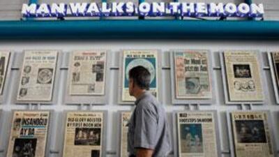 Newspapers published the day after the Apollo 11 astronauts landed on the moon are displayed at the Kennedy Space Center visitors' complex.