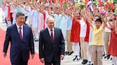 Russian President Vladimir Putin, right, is welcomed by Chinese President Xi Jinping at a ceremony at the Great Hall of the People in Beijing. EPA