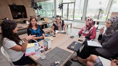Rama Chakaki, centre, at a meeting with the Palestinian Children's Relief Fund, in Dubai, on June 22, 2011. Chakaki has long mentored start-ups in the UAE, in Dubai. Jaime Puebla for The National