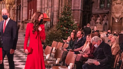 With her siblings Pippa and James, and parents Carole and Michael at the 'Together at Christmas' community carol service on December 8, 2021. Getty Images