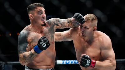 Tom Aspinall lands a punch on Sergei Pavlovich during the first round of their heavyweight interim title bout. AP