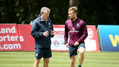 Luke Shaw talks with England manager Roy Hodgson during a training session in Portugal on May 21, 2014. Richard Heathcote / Getty Images