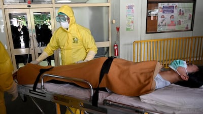 Health workers wearing protective gear take part in an exercise in handling a suspected patient at Sanglah hopital in Denpasar, Indonesia's resort island of Bali. AFP