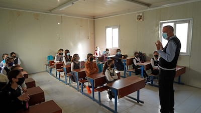 Lessons begin for girls from a Yazidi displaced persons camp in the Sharya area, about 15 kilometres from the city of Dohuk in Iraqi Kurdistan. AFP