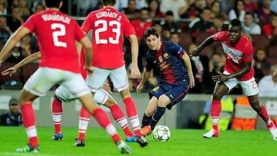 Barcelona's forward Lionel Messi, centre, takes on half the Spartak Moscow team.