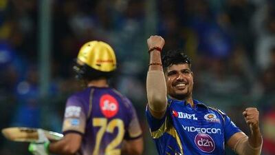 Mumbai Indians bowler Karn Sharma, right, celebrates the dismissal of Kolkata Knight Riders captain and batsman Gautam Gambhir for 12 runs during the 2017 Indian Premier League (IPL) Twenty20 second qualifier cricket match between Mumbai Indians and Kolkata Knight Riders in Bangalore on May 19, 2017. Manjunath Kiran / AFP