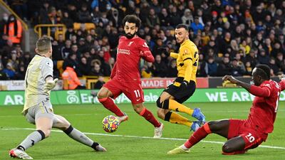 Liverpool's Mohamed Salah and Sadio Mane miss a chance to score. AFP