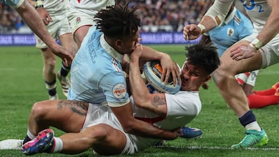 England's Marcus Smith squeezes over the line for a try in the Six Nations match against France in Paris, which the home side edged by 48-46, winning the tournament in the process. AFP