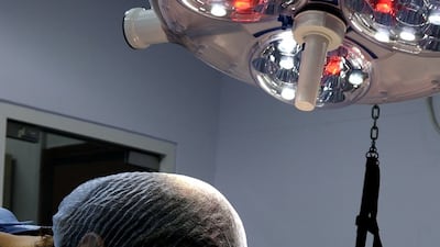 Dr Nicolas Terraz, head veterinarian, operating on Winter.