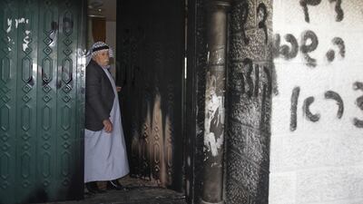 A mosque was vandalised by Israeli settlers in the West Bank village of Deir Istiya, near the Jewish settlement of Ariel, on Wednesday. Abed Omar Qusini / Reuters