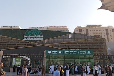 Pilgrims pass the International Fair and Museum of the Prophet’s Biography near Al Masjid Al Nabawi in Madinah, Saudi Arabia. Getty Images