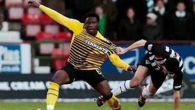 Celtic's Victor Wanyama, left, holds off the challenge of Dunfermline's Gary Mason. David Moir / Reuters