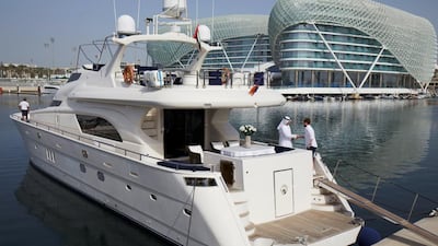 Ricky Wilson boards a yacht at Yas Marina. Courtesy Etihad Airways