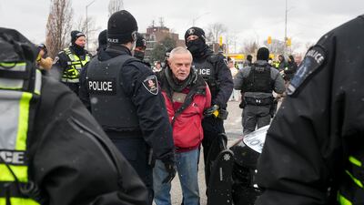 Canadian police arrest a protester at the Ambassador Bridge in Windsor, Ontario. Photo: AP