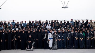 Sheikh Mohamed bin Zayed, Crown Prince of Abu Dhabi and Deputy Supreme Commander of the Armed Forces, stands for a photograph with Emirati ministers, FNC members and women from the civil and military sectors, on Emirati Women's Day in 2016. Courtesy Sheikh Mohamed bin Zayed Twitter