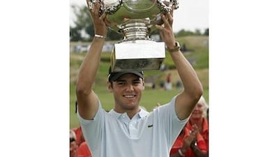 Martin Kaymer of Germany raises the cup after winning the French Open. Kaymer won on the first hole of a play-off.