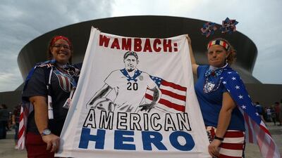 NEW ORLEANS, LA - DECEMBER 16: Fans pose with a sign for Abby Wambach #20 of the United States before the women's soccer match against China at the Mercedes-Benz Superdome on December 16, 2015 in New Orleans, Louisiana. Chris Graythen/Getty Images/AFP== FOR NEWSPAPERS, INTERNET, TELCOS & TELEVISION USE ONLY ==