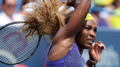Serena Williams returns a shot to Ana Ivanovic during her win in the final at the Cincinnati Open on Sunday. Mark Lyons / EPA / August 17, 2014