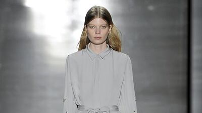 The new evening wear at Noon by Noor. The Bahraini designers, Sheikhas Haya and Noor Al Khalifa of Noon by Noor, played with colour this season. Their muted palette included purples, blacks, whites and navy, with a primary focus on grey. “We wanted to focus on getting the shapes right and just working on a more simple look,” said Sheikha Haya. The Al-Khalifa cousins added texture to their garments, by weaving in laser-cut leather, embossed and foil knit fabrics. Their lace-up high-top trainer-meets-brogues offered a juxtaposition to the feminine prints and silhouettes. The designers also experimented with glittering embroidery on simpler fabrics, carrying a metallic feel throughout. A full-length, pale grey evening gown was softly pleated at the shoulders and the forearms detailed with crystal flowers, a design that grew in density from the elbow to the wrist. Courtesy Noon by Noor