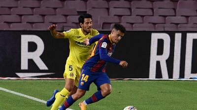 Villarreal's Spanish midfielder Daniel Parejo challenges Barcelona's Brazilian midfielder Philippe Coutinho. AFP