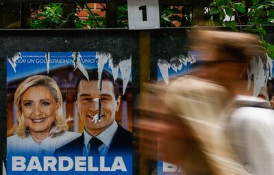 Posters of Marine Le Pen, leader of the French extreme right party National Rally, and Jordan Bardella, outside a polling station in Malakoff, near Paris. EPA