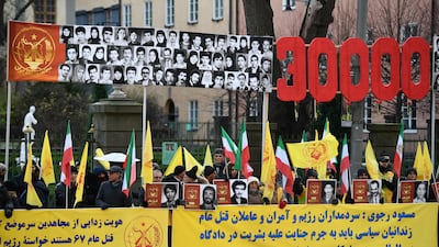 Protesters outside Stockholm District Court during Hamid Noury's trial. EPA