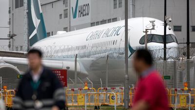A Cathay Pacific jet is parked in the hangar area at Hong Kong International Airport. Cathay said its revenue dropped 9.4 per cent to US$1.9 billion, its worst financial results since 2008. Jerome Favre / EPA