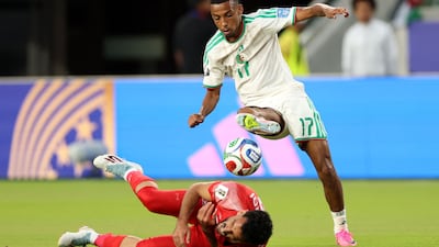 Mahmoud Almardi of Jordan reacts after a challenge from Rafik Belghali of Algeria. AFP