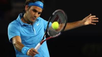 Roger Federer of Switzerland plays a backhand in his men's final match against Andy Murray of Great Britain at the 2010 Australian Open in Melbourne, Australia.
