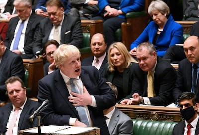 Former Prime Minister Theresa May (top R) listening alongside fellow Conservative MPs to Boris Johnson. AFP