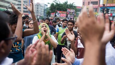 Bangladeshi students shout slogans as they block a road during a protest in Dhaka, Bangladesh. AP Photo / A. M. Ahad