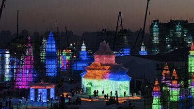 Chinese labourers work on large ice sculptures in preparation for the Harbin Ice and Snow Festival. Getty Images