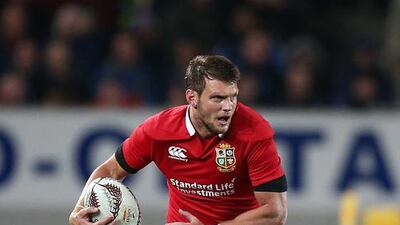 Dan Biggar of British & Irish Lions runs with the ball during their defeat to Blues. David Rowland / EPA