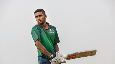 Young cricketer Jonathan Figy practices at the Zayed Cricket Stadium. Antonie Robertson / The National