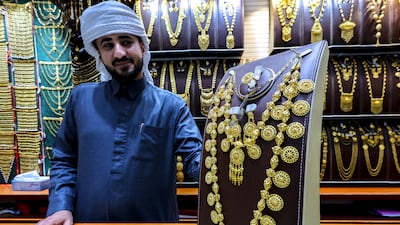 A gold retailer shows his jewellery at Madinat Zayed Gold Centre in Abu Dhabi. Victor Besa / The National