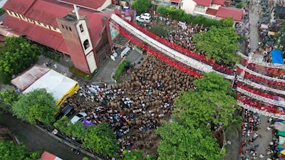 Devout Catholics gather at the church