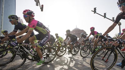 Cyclists pass by Emirates Palace on Friday during the second stage of the Abu Dhabi Tour. Mona Al Marzooqi / The National