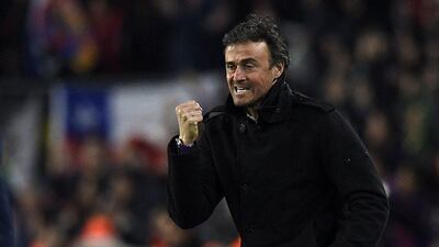 Barcelona coach Luis Enrique celebrates after a goal during his side's La Liga win over Atletico Madrid on Sunday. Lluis Gene / AFP