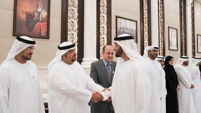 HH Sheikh Mohamed bin Zayed Al Nahyan Crown Prince of Abu Dhabi Deputy Supreme Commander of the UAE Armed Forces (R), greets a member of the Family Development Foundation, during an iftar reception at Al Bateen Palace. Mohamed Al Hammadi / Crown Prince Court - Abu Dhabi
