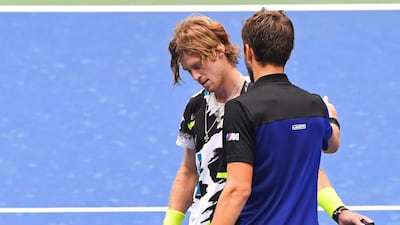 Daniil Medvedev greets Andrey Rublev at the net after their US Open quarter-final match. Reuters