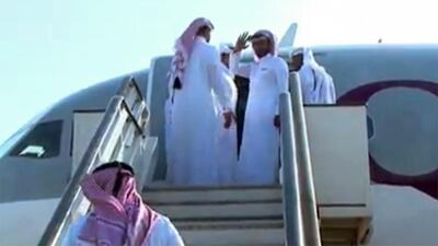 Qatari men who were kidnapped while hunting in southern Iraq in 2015 boarding a plane at Baghdad airport following their release on April 21, 2017. Sources close to the negotiations said their release was part of a far-reaching regional deal involving the release of prisoners and the evacuation of civilians in neighbouring Syria on April 21, 2017. AFP Photo / HO / Iraqi interior ministry