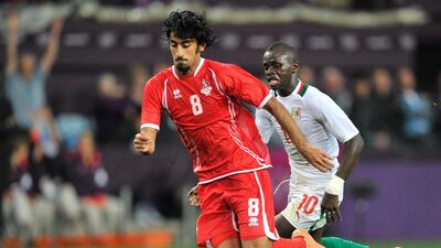 Hamdam Al Kamali of United Arab Emirates battles for the ball against Sadio Mane of Senegal. Getty Images