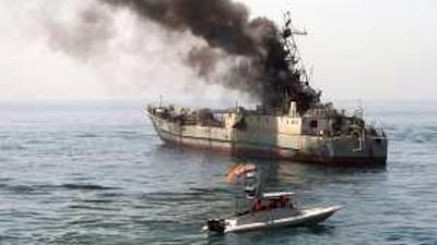 Iran's Revolutionary Guard use an abandoned warship as a target during exercises in the Arabian Gulf.