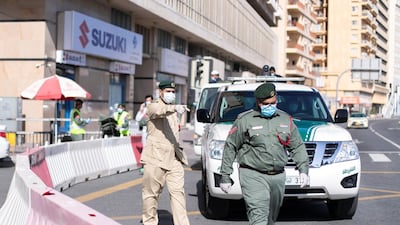 Dubai Police conduct regular inspections to ensure everyone is following coronavirus rules. Reem Mohammed / The National